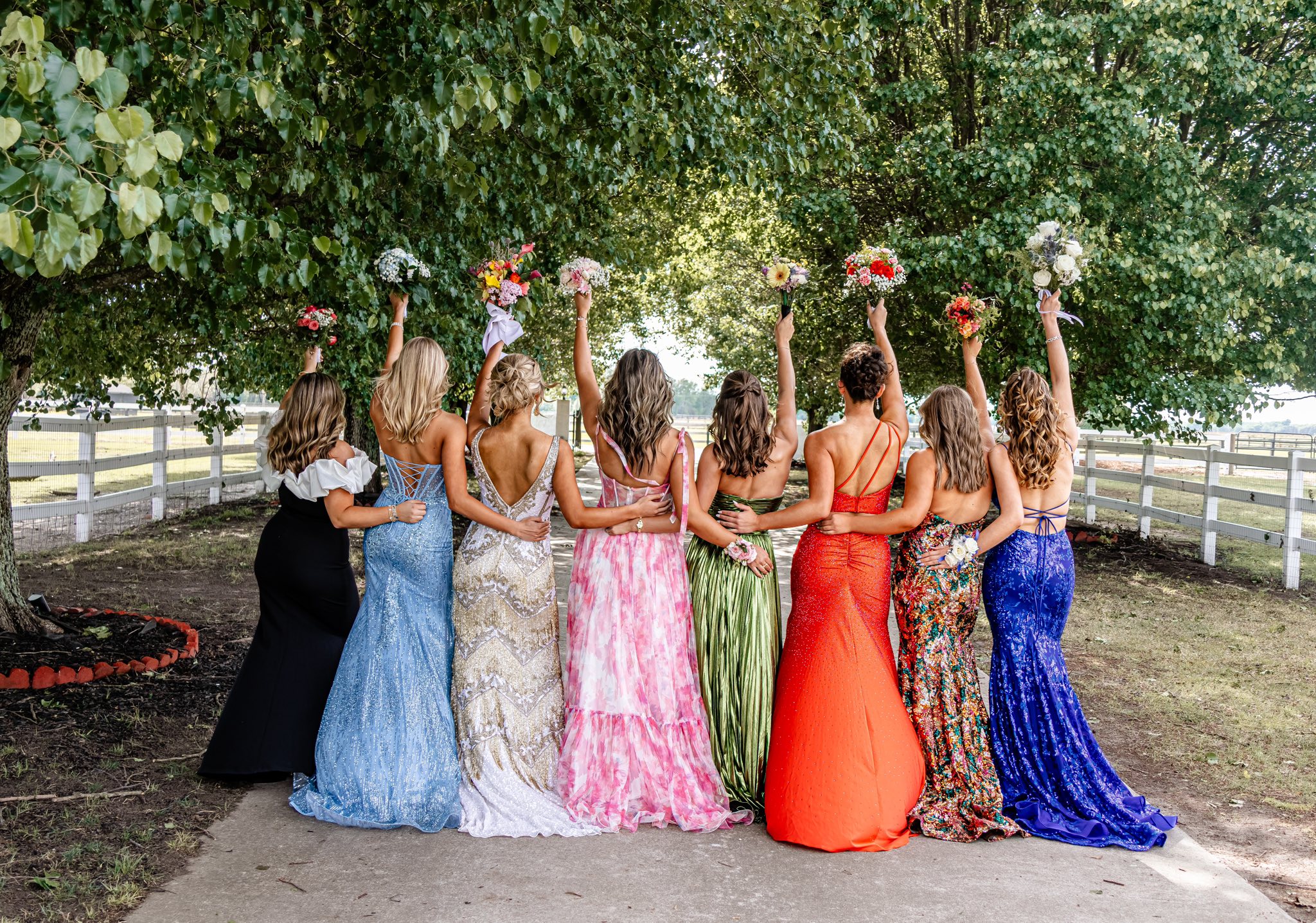 Prom group portrait beneath the trees on the Parkton Place driveway