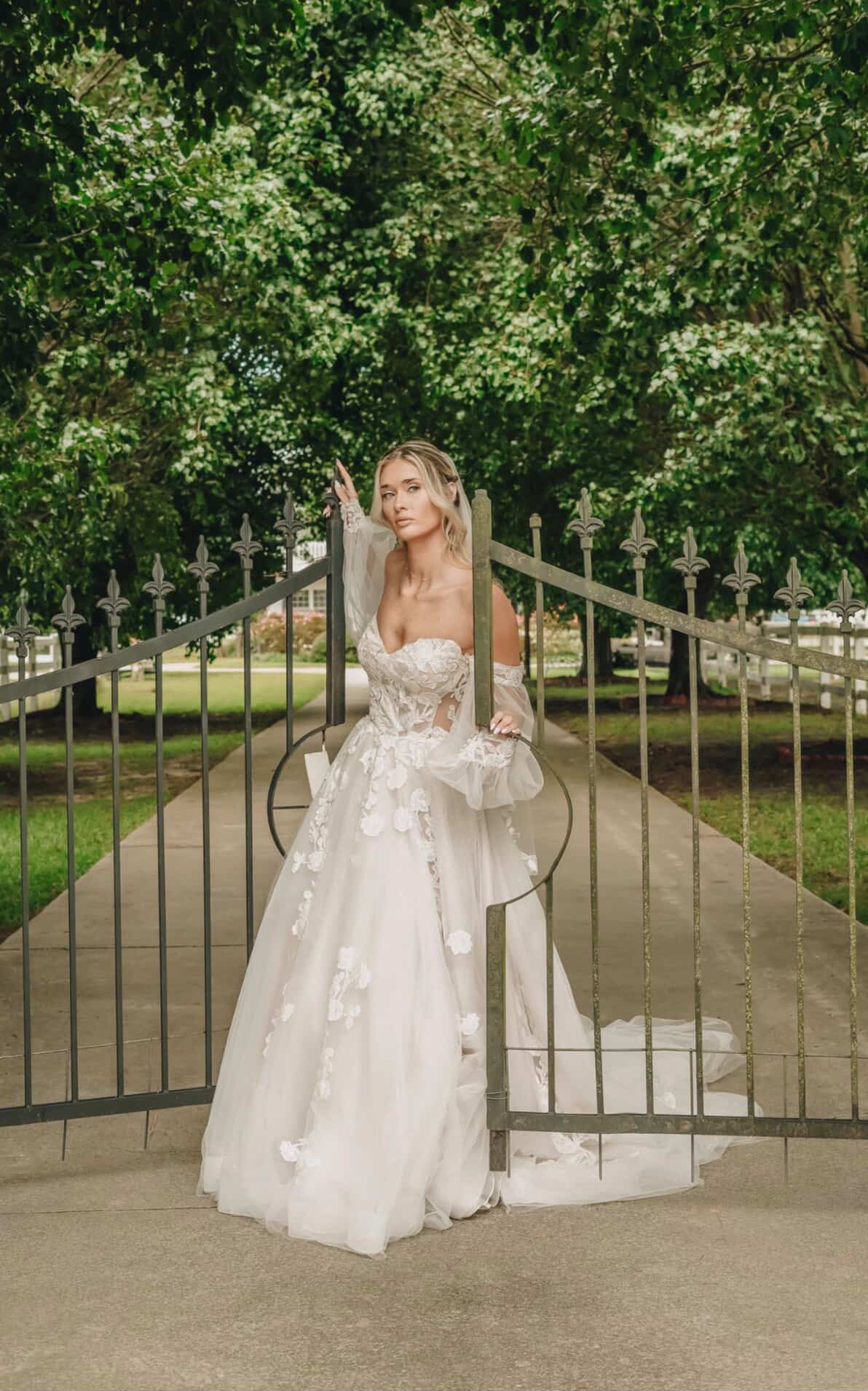 Bridal editorial portrait at the iron gate entrance of Parkton Place