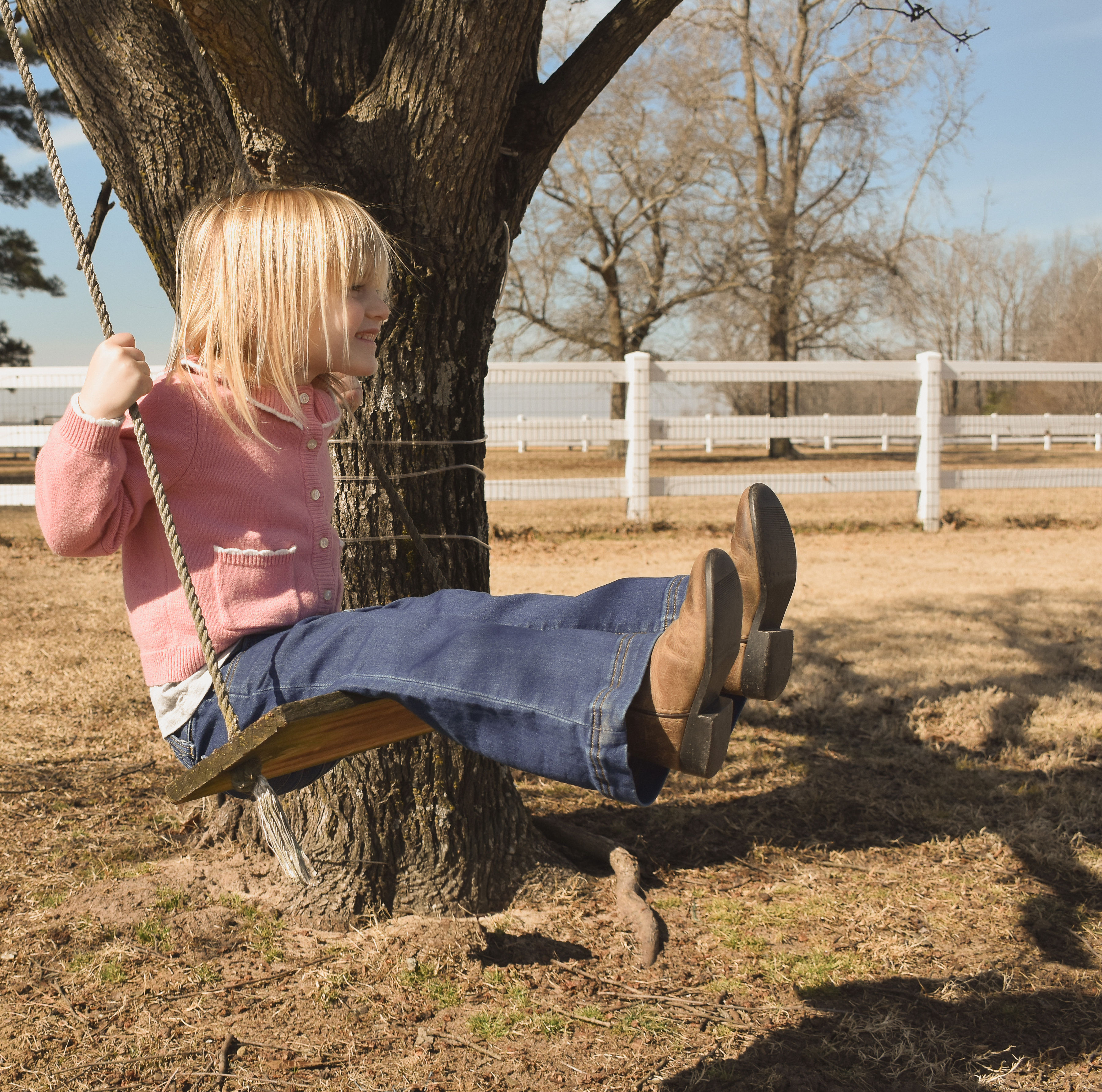 Girl on a tree swing at Parkton Place