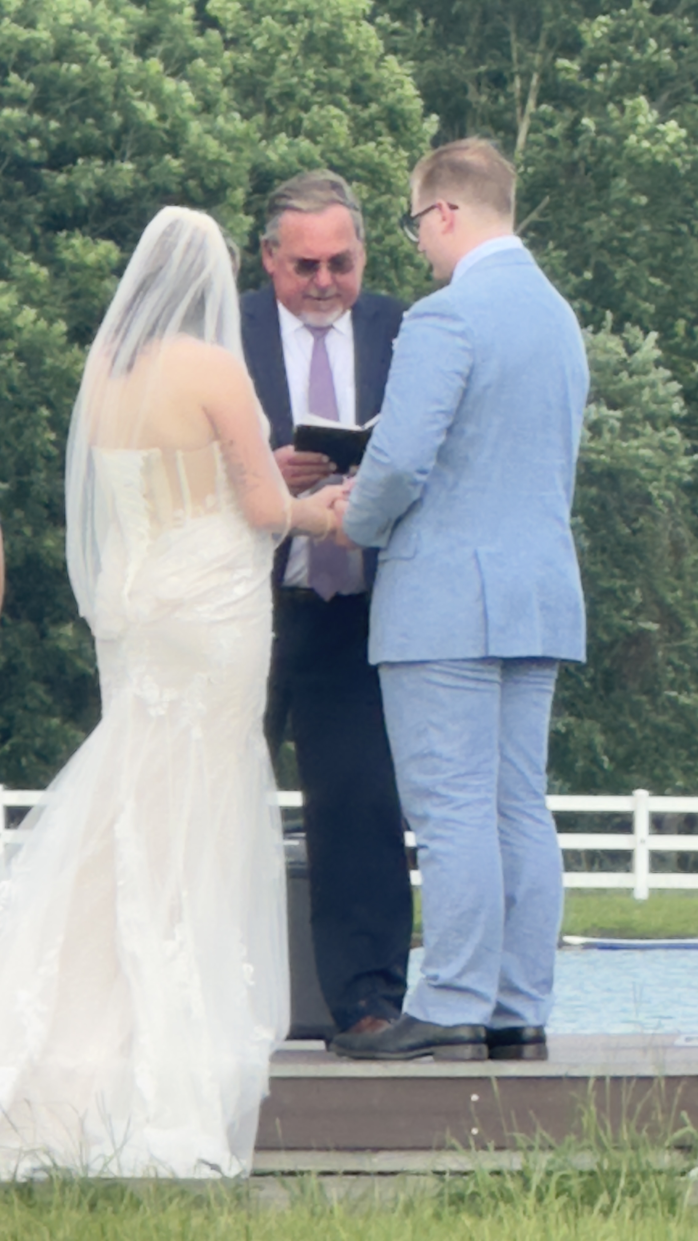 Wedding ceremony on the dock at the Parkton Place pond