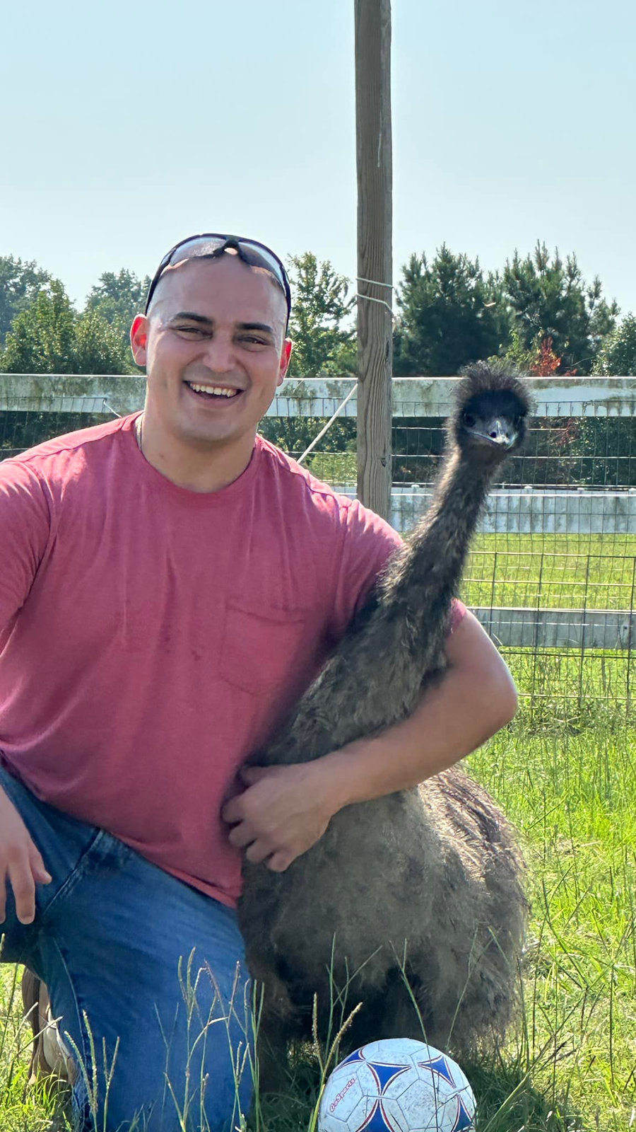 Client smiling with an emu at Parkton Place